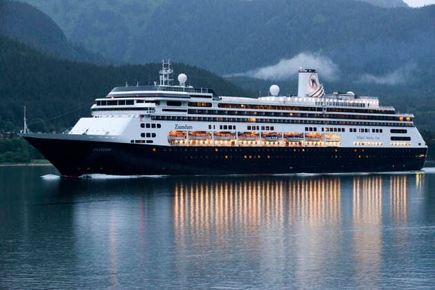 Zaandam, sailing near the South Franklin dock, at night, Juneau, Alaska. Designed to carry fewer guests while providing more space for maximum comfort, ms Zaandam is a prize in the mid-size ship category. Offering spacious public areas and plush accommodations, many staterooms have private verandahs. The musically themed Zaandam offers a unique shipboard atmosphere. Inspired by the world s great music, artifacts and memorabilia from a variety of musical genres decorate the ship. You ll find musical instruments such as Bill Clinton s saxophone and signed guitars from Queen, Iggy Pop, Eric Clapton and the Rolling Stones used as art objects throughout the ship. At the heart of Zaandam, in a soaring three-story atrium: a Baroque-style Dutch pipe organ, inspired by the traditional barrel organs still found on the streets of The Netherlands. En Copyright: xSergixReboredox REB-17-0140