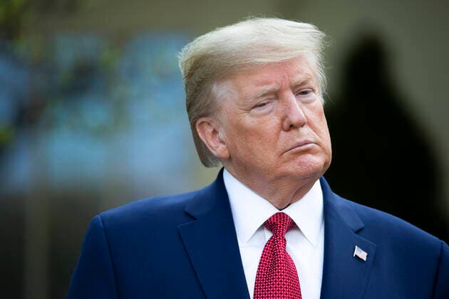 March 29, 2020, Washington, District of Columbia, USA: United States President Donald J. Trump listens during a news conference on the COVID-19 pandemic in the Rose Garden of the White House in Washington D.C., U.S. on Sunday, March 29, 2020. Trump announced that restrictions related to the Coronavirus will be extended until April 30, 2020. Credit: CNP Washington USA - ZUMAs152 20200329_zaa_s152_043 Copyright: xStefanixReynoldsx