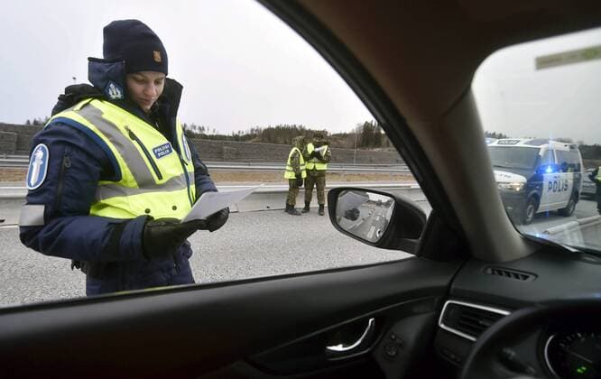 Police checks documents in the morning at a traffic control post in Lohja, Finland on March 30, 2020. The Finnish Government has decided to restrict traffic between the Region of Uusimaa and other regions to prevent coronavirus infections and to slow the spread of the epidemic in Finland. Lohja Finland  Copyright: xJussixNukarix LKLAPJ20200330062850L360