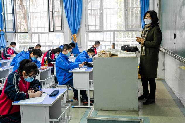 (200330) -- HOHHOT, March 30, 2020 -- Graduating students attend a class at Hohhot No. 35 Middle School in Hohhot, north China s Inner Mongolia Autonomous Region, March 30, 2020. Students in their final year of senior and junior high schools in Inner Mongolia returned to school and embraced their new spring semester on Monday. ) CHINA-INNER MONGOLIA-SCHOOL REOPENING (CN) LianxZhen 