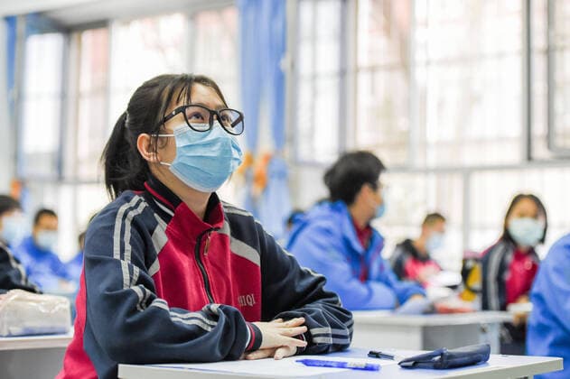 (200330) -- HOHHOT, March 30, 2020 -- Graduating students attend a class at Hohhot No. 35 Middle School in Hohhot, north China s Inner Mongolia Autonomous Region, March 30, 2020. Students in their final year of senior and junior high schools in Inner Mongolia returned to school and embraced their new spring semester on Monday. ) CHINA-INNER MONGOLIA-SCHOOL REOPENING (CN) LianxZhen 
