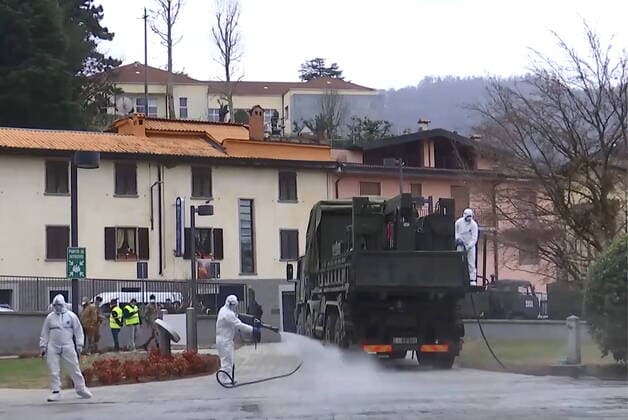 LOMBARDY, ITALY - MARCH 30, 2020: A brigade of Russian epidemiologists and experts of the Troops of Radiological, Chemical and Biological Defence of the Russian Defence Ministry together with Italian military specialists carry out a full disinfection of the Casa Serena residence for senior citizens in the town of Leffe, the province of Bergamo. Video screen grab. Russian Defence Ministry TASS  TS0D3D95