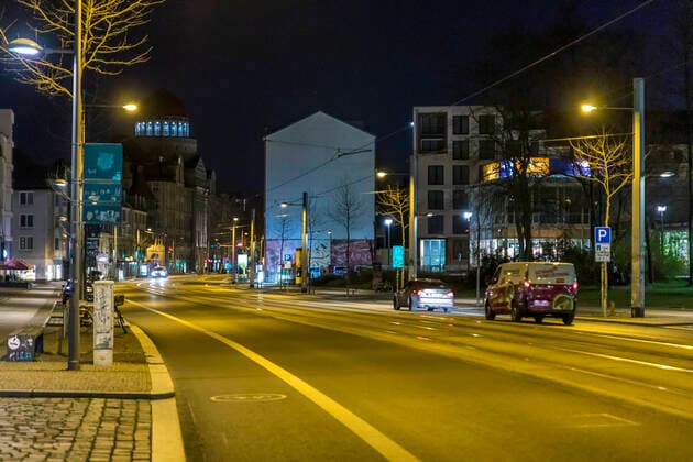 Due to the current general decree for protection against the corona virus, Leipzig has become a ghost town Only a few people go out onto the streets late in the evening Where otherwise highly frequented bars are open, there is a yawning emptiness