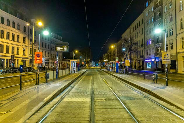 Due to the current general decree for protection against the corona virus, Leipzig has become a ghost town Only a few people go out onto the streets late in the evening Where otherwise highly frequented bars are open, there is a yawning emptiness