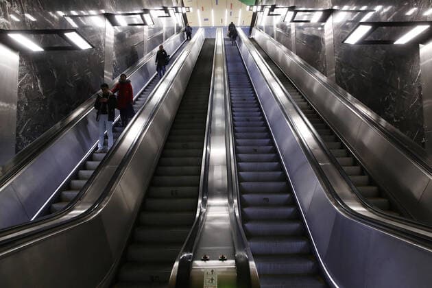 MOSCOW, RUSSIA - MARCH 30, 2020: Passengers on escalators at Khoroshevskaya Station of the Moscow Metro. Russian President Vladimir Putin declared a week off work from 28 March to 5 April 2020 and urged people to stay home to curb the spread of the coronavirus infection. From 30 March 2020, the Moscow government has imposed home isolation for all Moscow residents, regardless of their age. Sergei Fadeichev TASS  TS0D3D73