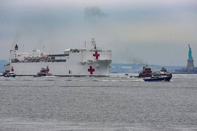 March 30, 2020, New York, New York, United States: The USNS Comfort hospital ship is seen on the Hudson River near the Statue of Liberty in New York in the States on Monday morning, 30. The USNS Comfort has the capacity to serve 1000 patients, and arrived to help fight the new coronavirus pandemic. New York United States - ZUMAv122 20200330_zap_v122_003 Copyright: xWilliamxVolcovx