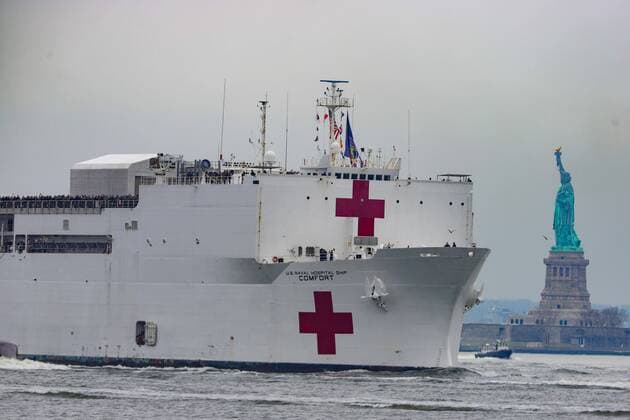 March 30, 2020, New York, New York, United States: The USNS Comfort hospital ship is seen on the Hudson River near the Statue of Liberty in New York in the States on Monday morning, 30. The USNS Comfort has the capacity to serve 1000 patients, and arrived to help fight the new coronavirus pandemic. New York United States - ZUMAv122 20200330_zap_v122_009 Copyright: xWilliamxVolcovx