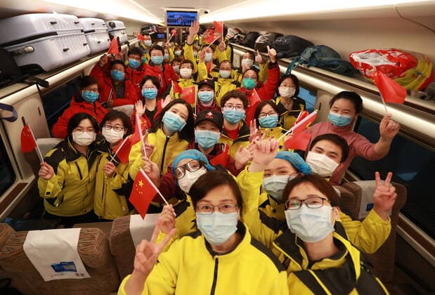(200330) -- WUHAN, March 30, 2020 -- Medical workers take photos on the departure train in Wuhan, central China s Hubei Province, March 30, 2020. A total of 132 medical workers from the Third Xiangya Hospital of Central South University in Hunan left Wuhan on Monday after finishing their task. (Photo by Xinhua) CHINA-WUHAN-COVID-19-MEDICS FROM HUNAN PROVINCE-DEPARTURE (CN) ZhaoxJun 