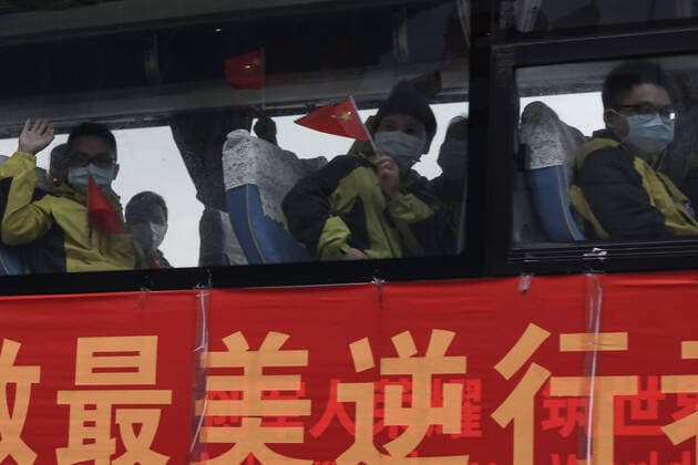 (200330) -- WUHAN, March 30, 2020 -- A bus carrying medical workers arrives at Wuhan Railway Station in Wuhan, central China s Hubei Province, March 30, 2020. A total of 132 medical workers from the Third Xiangya Hospital of Central South University in Hunan left Wuhan on Monday after finishing their task. (Photo by Xinhua) CHINA-WUHAN-COVID-19-MEDICS FROM HUNAN PROVINCE-DEPARTURE (CN) ZhaoxJun 