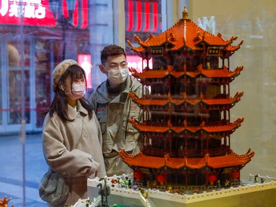 (200330) -- WUHAN, March 30, 2020 -- People stay at a shop of a commercial street in Wuhan, central China s Hubei Province, March 30, 2020. Commercial streets in Wuhan are resuming vitality as the coronavirus epidemic wanes. ) CHINA-HUBEI-WUHAN-STREET-RESUMPTION (CN) ShenxBohan 