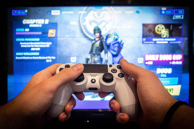 Video games during coronavirus - Zagreb, Croatia 30.03.2020., Zagreb, Croatia - Children staying home during coronavirus don t have much options than spending their time playing videogames on mobile phone and Playstation. DavorxPuklavec PIXSELL