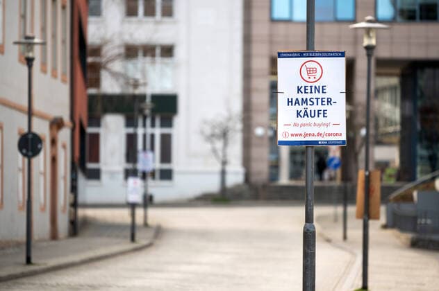 Coronavirus We remain in solidarity Poster campaign of the city of Jena on 30 3 2020 No hamster purchases No panic buying Poster in the deserted inner city Inner city Jena