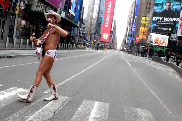 March 30, 2020, New York City, New York, US: In the city that never sleeps and at the Crossroads of the World, a magnet that is Times Square, indications of life is to been seen. Pictured is Robert John Burck better known as the Naked Cowboy, an American actor, singer, songwriter, writer and street performer in an empty Times Square. New York City US - ZUMAl135 20200330_zap_l135_021 Copyright: xG.xRonaldxLopezx
