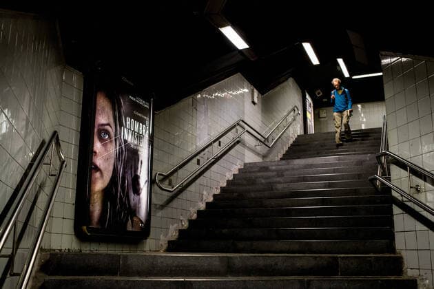 March 30, 2020, Barcelona, Catalonia, Spain: A man passes by an empty corridor of Barcelona subway. Daily coronavirus deaths fall slightly with 812 Covid-19 victims in the last 24 hours in Spain, Spanish government has ordered new lockdown restrictions. Barcelona Spain - ZUMAb137 20200330_zap_b137_014 Copyright: xJordixBoixareux