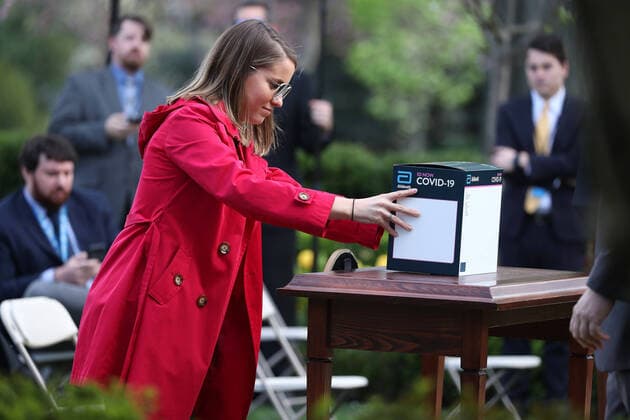 A White House staffer places a box for Abbott s ID NOW COVID-19 test kit on a table before the start of a press briefing by the Coronavirus Task Force on the coronavirus and COVID-19 pandemic, in the Rose Garden at the White House, in Washington, DC, USA, 30 March 2020. Copyright: xMichaelxReynoldsx