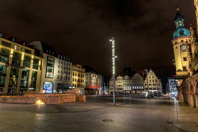 Due to the current general decree for protection against the corona virus, Leipzig has become a ghost town Only a few people go out onto the streets late in the evening Where otherwise highly frequented bars are open, there is a yawning emptiness