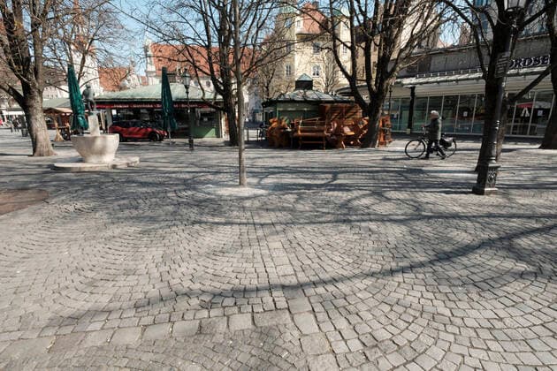 The beer garden at the Viktualienmarkt deserted exit restriction in Bavaria due to corona pandemic Day 4, Munich on 2020