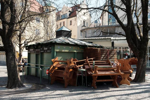 The beer garden at the Viktualienmarkt deserted exit restriction in Bavaria due to corona pandemic Day 4, Munich on 2020
