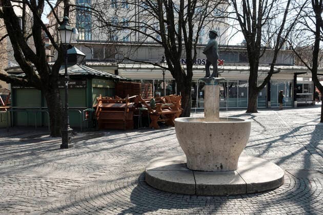 The Weiss Ferdl Fountain at the Beer Garden at Viktualienmarkt deserted exit restriction in Bavaria due to Corona Pandemic Day 4, Munich on 2020