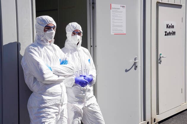 Dortmund, 31 3 2020 At Klinikum Nord in Dortmund there is a corona test centre of the Kassenärztliche Vereinigung since Saturday 21 3 2020 In tents and containers people can be tested for the virus Photo Doctors and staff in protective clothing stands ready to perform a corona test