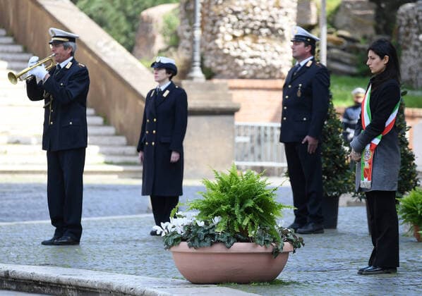 (200331) -- ROME, March 31, 2020 (Xinhua) -- Mayor of Rome Virginia Raggi (1st R) attends a memorial ceremony to mourn the country s dead due to coronavirus disease (COVID-19), in Rome, Italy, March 31, 2020. The coronavirus pandemic claimed 11,591 lives in locked-down Italy up to Monday, as the cumulative number of cases reached 101,739, according to the latest data by the Civil Protection Department. (Photo by Alberto Lingria Xinhua) ITALY-ROME-COVID-19-MEMORIAL CEREMONY