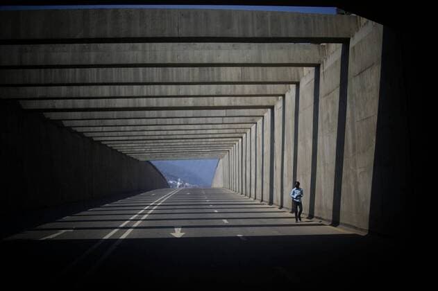 (200331) -- KATHMANDU, March 31, 2020 -- A man walks down the highway during the 8th day of lockdown in Kathmandu, Nepal on March 31, 2020. (Photo by Xinhua) NEPAL-KATHMANDU-LOCKDOWN-COVID-19 SulavxShrestha 