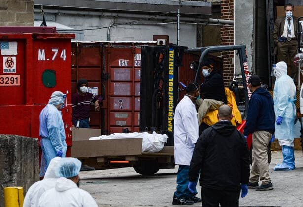March 31, 2020, New York Brooklyn, USA: Dead bodies loaded onto truck outside Brooklyn Hospital Center. The COVID-19 death toll in the city is 940 and 36,221 confirmed cases and NYC hospital have using bed sheets to wrap bodies because they no longer have body bags. 03 31 20 New York Brooklyn . . New York Brooklyn USA - ZUMAs252 20200331_znp_s252_005 Copyright: xMarcusxSantosx