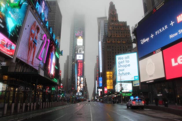 March 29, 2020, New York, New York, USA: A police car monitors a desperately empty Broadway Avenue lit by the gigantic illuminated signs of Times Square. Tourists and residents have disappeared from this mythic area as New York became the epicenter of Coronavirus. New York USA - ZUMA- Co 20200329_mda_b197_007 Copyright: xMariexLexBlex