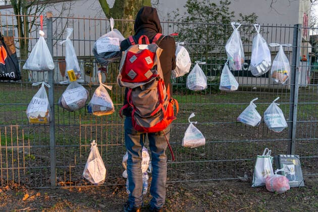 Gift fence with donations for the homeless and needy, food, hygiene articles, clothing, in Essen Rüttenscheid, effects of the corona crisis in Germany,