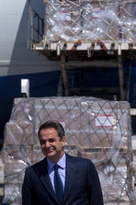 (200331) -- ATHENS, March 31, 2020 -- Greek Prime Minister Kyriakos Mitsotakis attends a ceremony at the Athens international airport in Athens, Greece, on March 31, 2020. Greek Prime Minister Kyriakos Mitsotakis expressed his gratitude on Tuesday to all those who have helped in Greece s battle against the COVID-19 epidemic at a ceremony at the Athens international airport where 8.3 million surgical masks arrived from China. They were the second batch of a total of 13.5 million masks purchased and donated by the Onassis Foundation in Greece to the Greek state to be delivered to hospitals nationwide. ) GREECE-ATHENS-COVID-19-MASKS-ARRIVAL MariosxLolos 