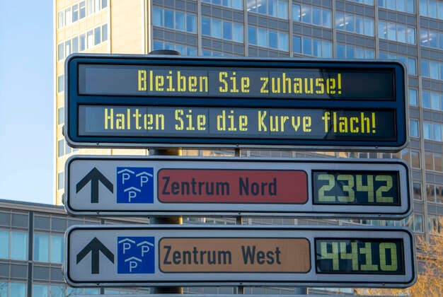 Notice board urges to stay home, Keep the curve flat, Effects of the corona crisis in Germany, Essen,