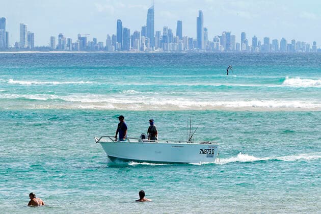 AUSTRALIA CORONAVIRUS COVID-19, A fishing boat navigates through the Currumbin Bar on the Gold Coast, Wednesday, April 1, 2020. New Federal Government restrictions for coronavirus implemented on Sunday night mean recreational boating and fishing for leisure is no longer permitted. Only those boating and fishing for essential purposes is allowed, including travelling to work, to get provisions from the shops, or those providing for their families. ( NO ARCHIVING, EDITORIAL USE ONLY, NO USE IN BOOKS WITHOUT CONSENT GOLD COAST QLD AUSTRALIA  Copyright: xDAVExHUNTx 20200401001461135451