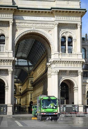(200331) -- MILAN (ITALY), March 31, 2020 (Xinhua) -- Sanitation workers clean the ground at Piazza del Duomo in Milan, Italy, on March 31, 2020. The COVID-19 pandemic continued to advance in locked down Italy on Tuesday, bringing the total number of infections, fatalities and recoveries to 105,792, according to the latest data released by the country s Civil Protection Department. (Photo by Daniele Mascolo Xinhua) ITALY-MILAN-COVID-19-CASES 