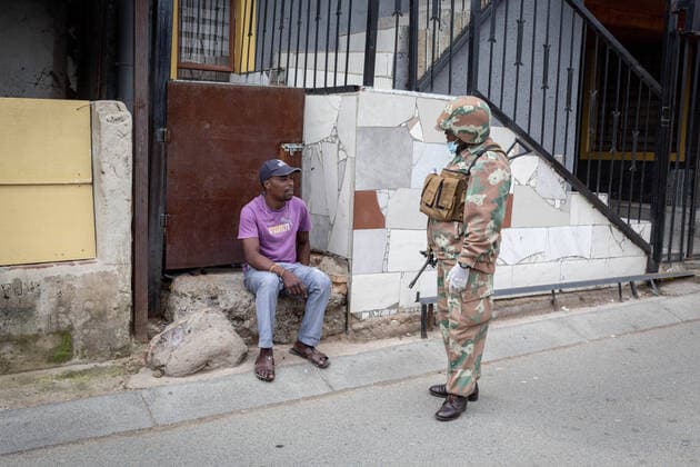 (200401) -- JOHANNESBURG, April 1, 2020 (Xinhua) -- A soldier asks a citizen the reason why he is out on the street in Johannesburg, South Africa, March 31, 2020. South African President Cyril Ramaphosa on Monday defended the 21-day national lockdown against the coronavirus pandemic which began on midnight Thursday, saying it is absolutely necessary. (Photo by Yeshiel Panchia Xinhua) SOUTH AFRICA-JOHANNESBURG-COVID-19 