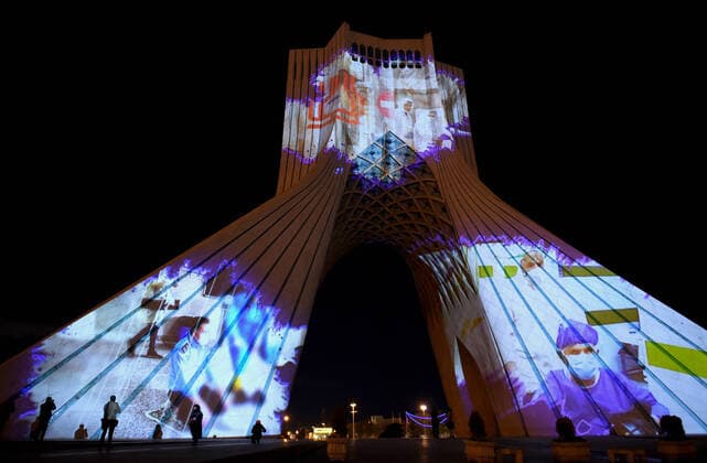 News Bilder des Tages (200401) -- TEHRAN, April 1, 2020 -- The Azadi Tower is illuminated in Tehran, Iran, March 31, 2020. The Azadi Tower, a landmark monument in the Iranian capital of Tehran, was lit up here on Tuesday night as part of a ceremony showing support for people around the world in the face of the novel coronavirus outbreak. (Photo by Xinhua) IRAN-TEHRAN-COVID-19-AZADI TOWER-ILLUMINATION AhmadxHalabisaz 