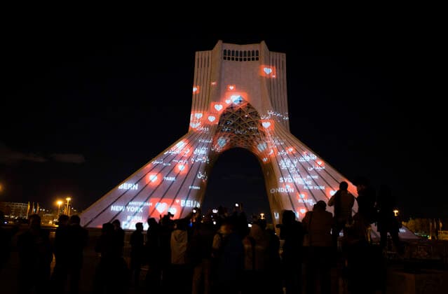 (200401) -- TEHRAN, April 1, 2020 -- The Azadi Tower is illuminated in Tehran, Iran, March 31, 2020. The Azadi Tower, a landmark monument in the Iranian capital of Tehran, was lit up here on Tuesday night as part of a ceremony showing support for people around the world in the face of the novel coronavirus outbreak. (Photo by Xinhua) IRAN-TEHRAN-COVID-19-AZADI TOWER-ILLUMINATION AhmadxHalabisaz 