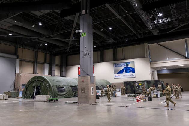March 31, 2020, Seattle, Washington, U.S: Soldiers assemble the pre-op room (left) at the field hospital in CenturyLink Field Event Center in Seattle, Washington on March 31, 2020. Soldiers from the 627th Army Hospital at Fort Carson, Colorado are deploying a field hospital for non-COVID-19 cases that will house 150 beds when completed. Seattle U.S. - ZUMAg235 20200331_zap_g235_002 Copyright: xPaulxChristianxGordonx