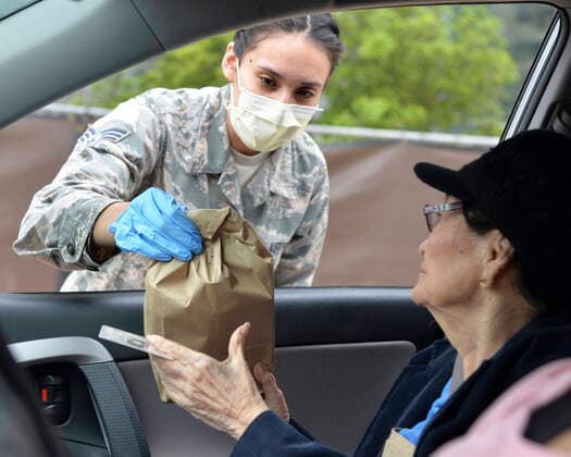 March 31, 2020, San Antonio, TX, United States of America: U.S. Air Force Senior Airman Reanne Kohlus, hands a prescription to a elderly patient during curbside service to assist with COVID-19, coronavirus pandemic relief at Joint Base San Antonio - Lackland March 30, 2020 in San Antonio,Texas. San Antonio United States of America - ZUMAp138 20200331_zaa_p138_017 Copyright: xKileyxDougherty U.S.xAirx