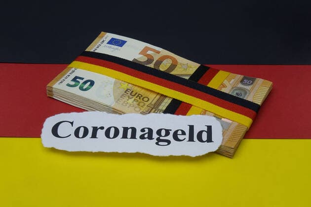 Money bundle and German flag Money bundle and German flag, 30 03 2020, Borkwalde, Brandenburg, Germany, On a German flag is a money bundle with the lettering Corona money