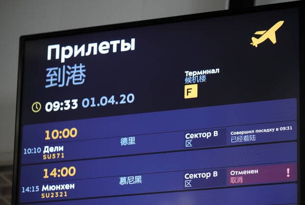 MOSCOW REGION, RUSSIA - APRIL 1, 2020: An arrivals board reading Delhi SU571 Landed at 9:31, Munich SU2321 Cancelled at Terminal D of Sheremetyevo International Airport. The airport shuts down Terminal D from April 1, 2020 due to decrease of passenger flow amid the COVID-19 coronavirus pandemic. All international flights are transferred to Terminal F, internal to Terminal B. Sergei Bobylev TASS  TS0D4084