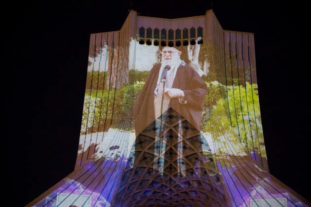 March 31, 2020, Tehran, Iran: A view at night of the lit-up Azadi (Freedom) tower with flags, messages of sympathy from all over the world over the ongoing novel coronavirus disease (COVID-19) pandemic, in Tehran, Iran. The appreciation message was also reflected in healthcare professionals who are trying to stop the pandemic in the country. The light display was organized by the city municipality. According to the latest reports by the Iranian Ministry of Health, over 2,000 people have died from the coronavirus infection throughout the country. Tehran Iran - ZUMAf146 20200331_zip_f146_007 Copyright: xRouzbehxFouladix