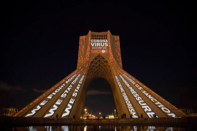 March 31, 2020, Tehran, Iran: A view at night of the lit-up Azadi (Freedom) tower with flags, messages of sympathy from all over the world over the ongoing novel coronavirus disease (COVID-19) pandemic, in Tehran, Iran. The appreciation message was also reflected in healthcare professionals who are trying to stop the pandemic in the country. The light display was organized by the city municipality. According to the latest reports by the Iranian Ministry of Health, over 2,000 people have died from the coronavirus infection throughout the country. Tehran Iran - ZUMAf146 20200331_zip_f146_011 Copyright: xRouzbehxFouladix