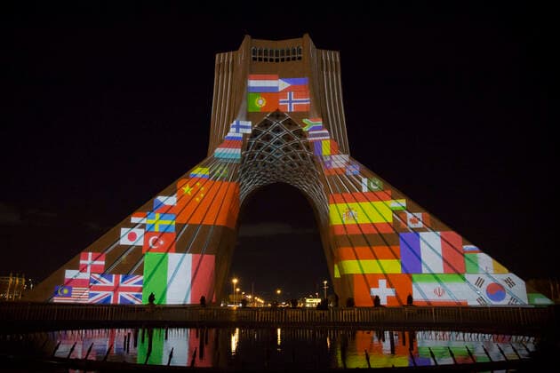 March 31, 2020, Tehran, Iran: A view at night of the lit-up Azadi (Freedom) tower with flags, messages of sympathy from all over the world over the ongoing novel coronavirus disease (COVID-19) pandemic, in Tehran, Iran. The appreciation message was also reflected in healthcare professionals who are trying to stop the pandemic in the country. The light display was organized by the city municipality. According to the latest reports by the Iranian Ministry of Health, over 2,000 people have died from the coronavirus infection throughout the country. Tehran Iran - ZUMAf146 20200331_zip_f146_014 Copyright: xRouzbehxFouladix