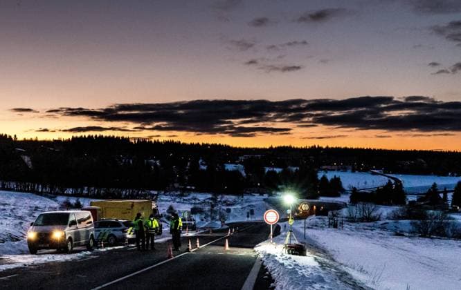 Czech policemen stand on a road at the Czech-German border for entry control in Cinovec, Czech Republic, March 31, 2020. (CTKxPhoto VojtechxHajek) CTKPhotoP202004010238301 HAJ 1