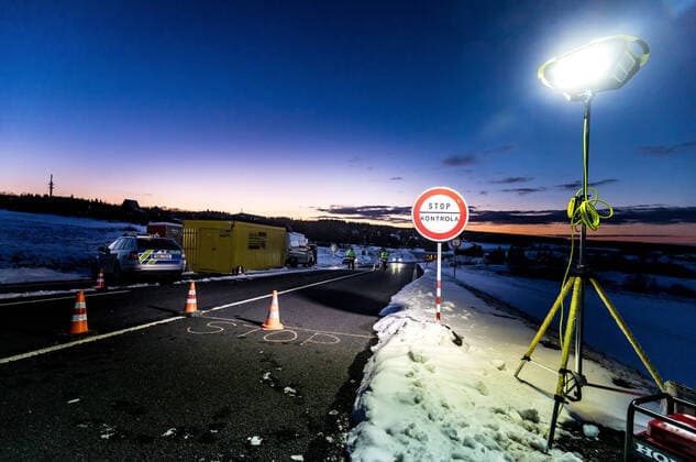 Czech policemen stand on a road at the Czech-German border for entry control in Cinovec, Czech Republic, March 31, 2020. (CTKxPhoto VojtechxHajek) CTKPhotoP202004010247801 HAJ 5