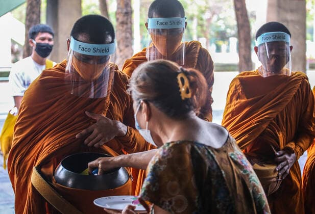 March 31, 2020, Bangkok, Abkhazia: Thai monks wearing protective masks as a preventive measure against the spread of COVID-19 pandemic receive alms in Bangkok..Thai Public Health Ministry reports 120 new cases of coronavirus (Covid-19), raising the total to 1,771 and 12 deaths. Bangkok Abkhazia - ZUMAs197 20200331_zaa_s197_129 Copyright: xPrawetxPuengsawangpholx