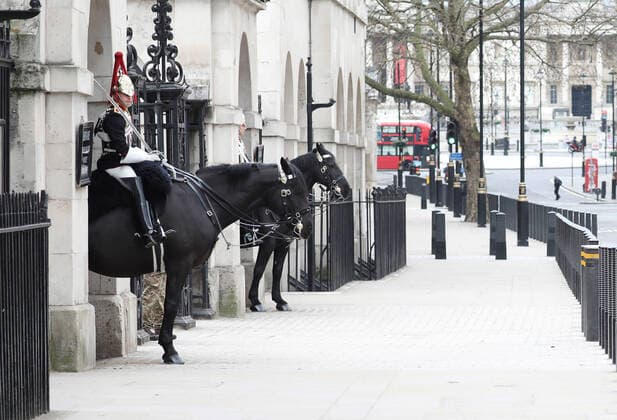 Day Nine of Lockdown in London. The Household Cavalry have no tourists around them whilst the country is on lockdown due to the COVID-19 Coronavirus pandemic. People are not allowed to leave home except for minimal food shopping, medical treatment, exercise - once a day, and essential work. COVID-19 Coronavirus lockdown, London, UK, on April 1, 2020 