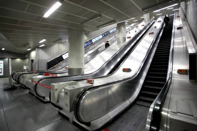 Day Nine of Lockdown in London. Only two people on the escalators at Kings Cross underground station this morning at approx 10.25. The country is on lockdown due to the COVID-19 Coronavirus pandemic. People are not allowed to leave home except for minimal food shopping, medical treatment, exercise - once a day, and essential work. COVID-19 Coronavirus lockdown, London, UK, on April 1, 2020 