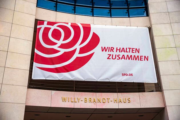 Banner We stick together on the façade of the Willy Brandt House in Berlin on April 1, 2020 To slow down the spread of the Coronavirus SARS CoV 2, the federal and state governments decided on further restrictions After museums, theatres, sporting events e