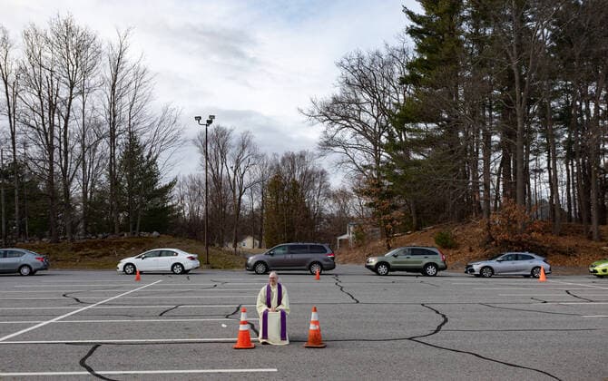 April 1, 2020, Chelmsford, Massachusetts, USA: Father Brian Mahoney at drive-up confessions in the parking lot of St. Mary Catholic Church during Covid-19 pandemic in Chelmsford.  (124964589)